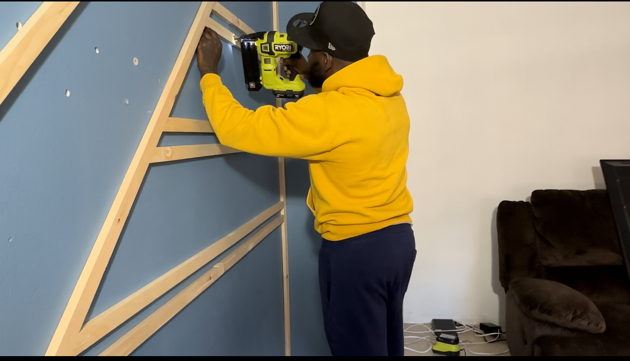 Wood trim accent wall build — deep blue base