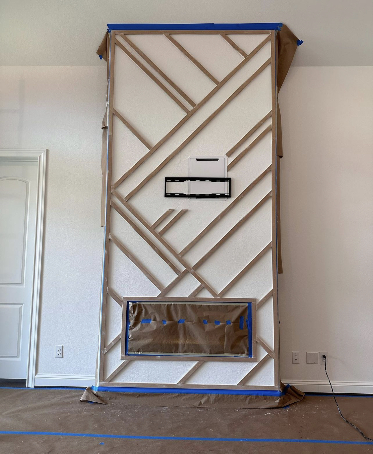 Layered geometric wood accent — install in progress